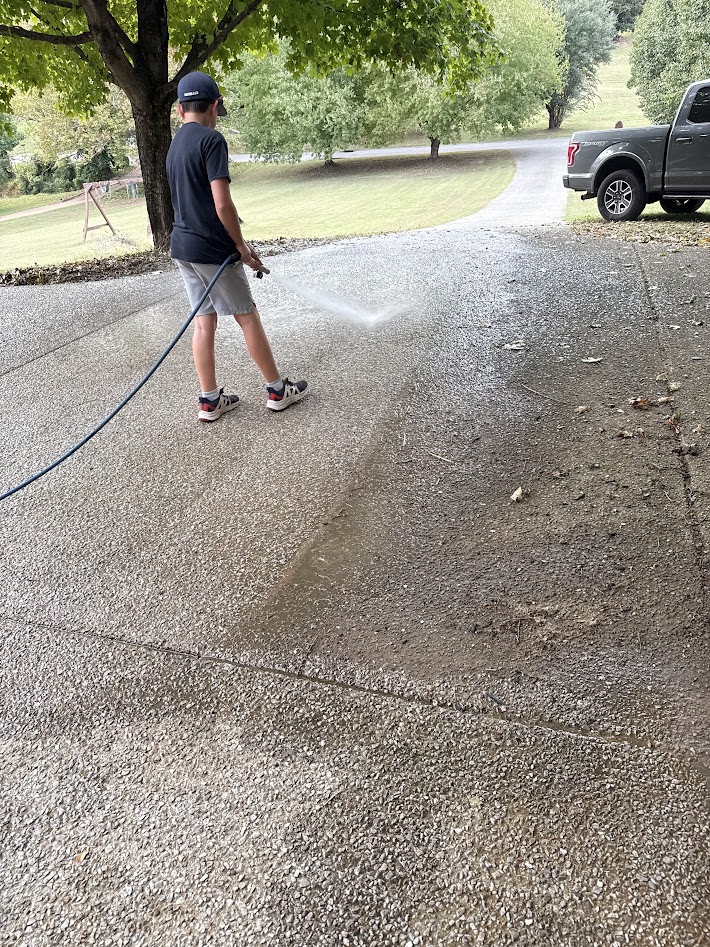 Professional driveway surface cleaning with commercial equipment in Middle Tennessee
